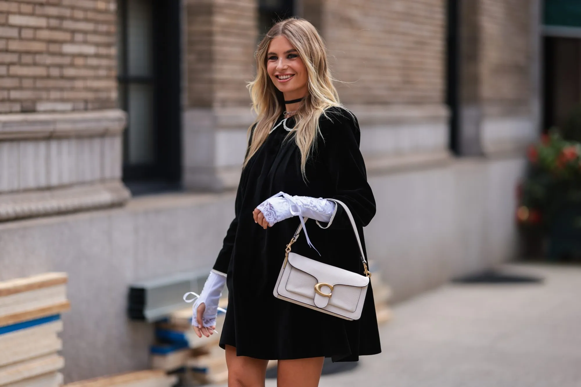 NEW YORK, NEW YORK - SEPTEMBER 12: Xenia Adonts seen wearing a black dress, outside coach during new york fashion week on September 12, 2022 in New York City. (Photo by Jeremy Moeller/Getty Images)