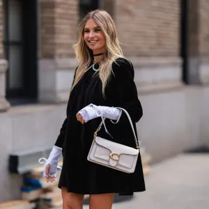 NEW YORK, NEW YORK - SEPTEMBER 12: Xenia Adonts seen wearing a black dress, outside coach during new york fashion week on September 12, 2022 in New York City. (Photo by Jeremy Moeller/Getty Images)