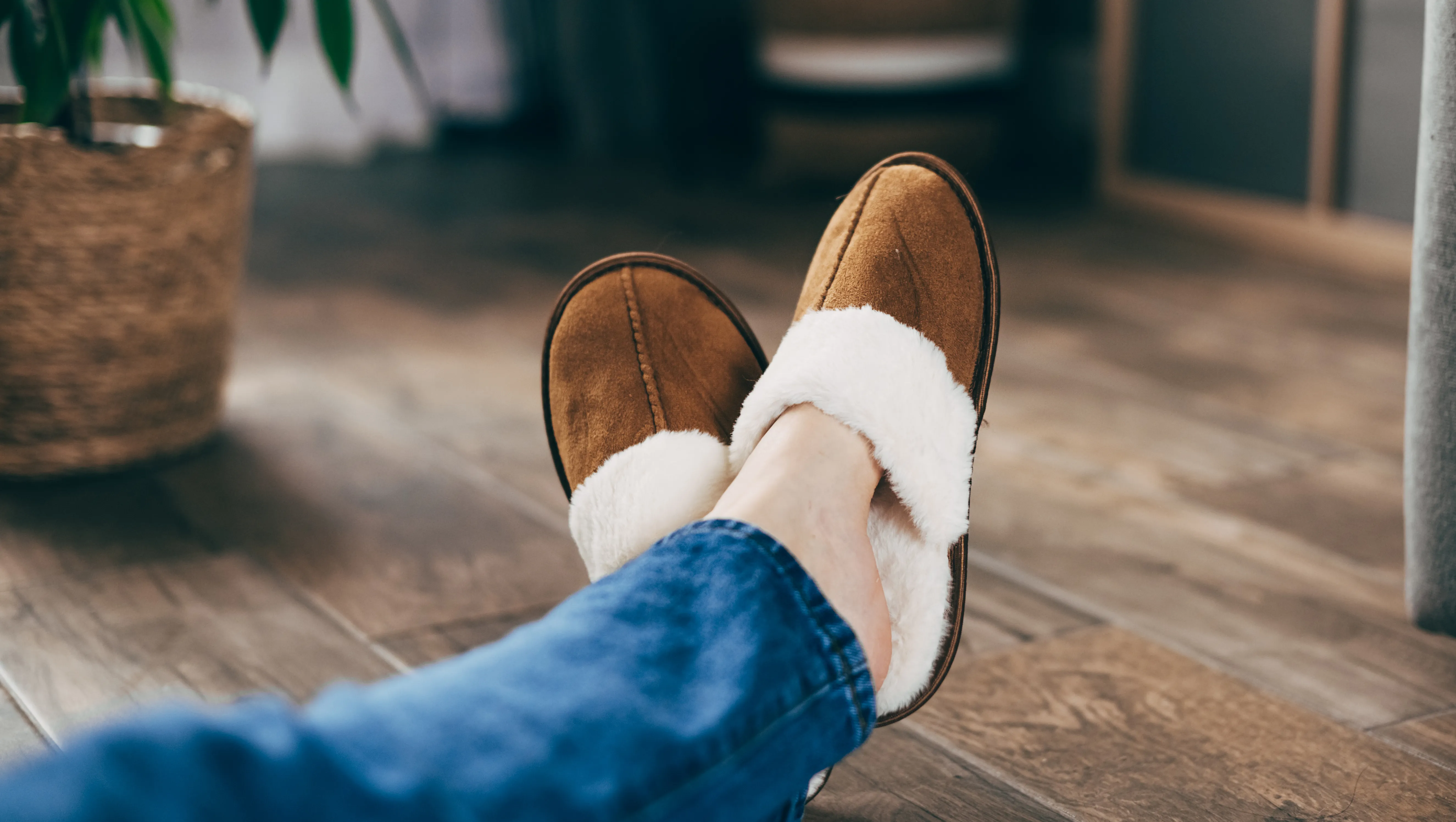 Woman in soft slippers at home, closeup