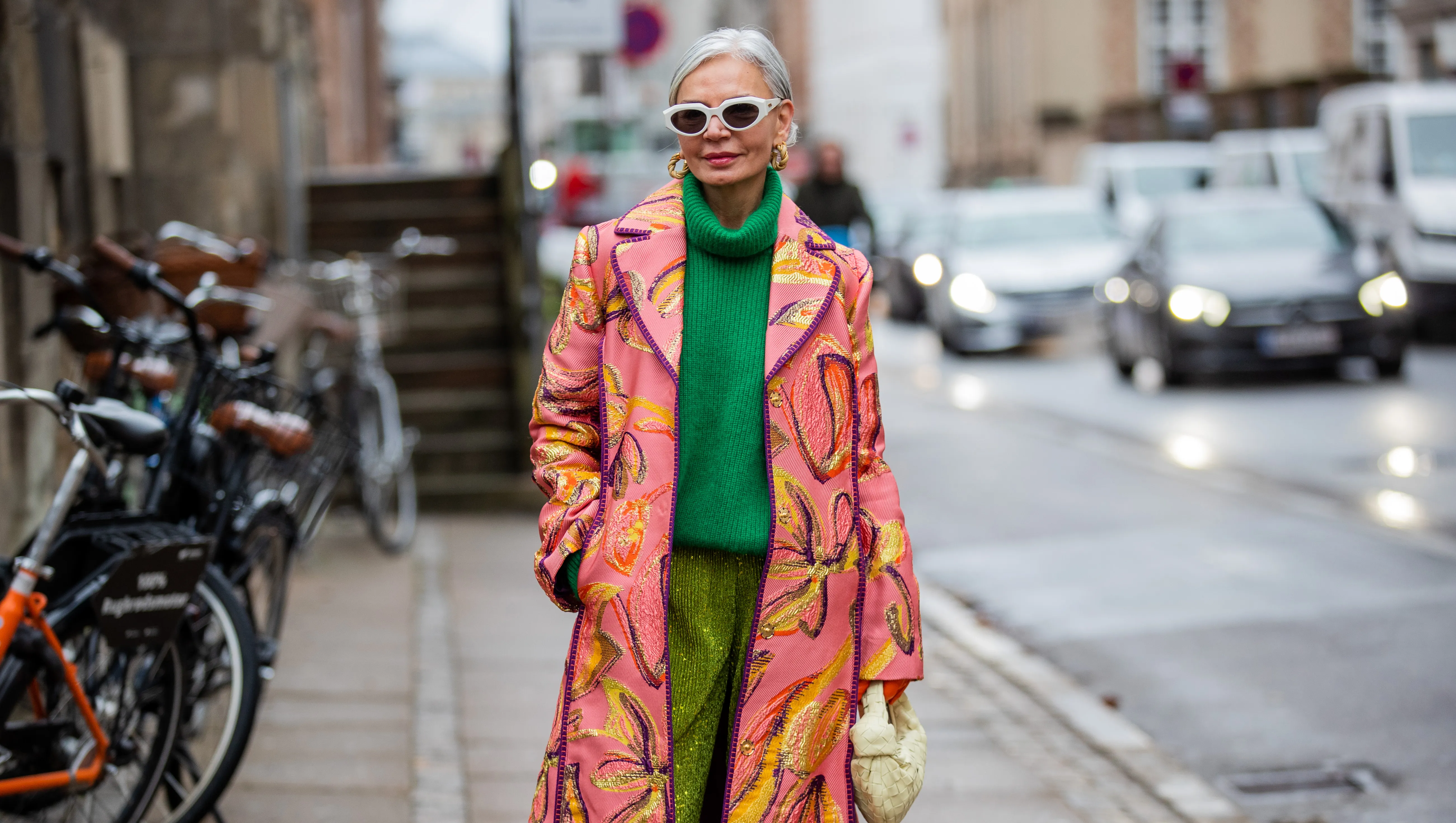 COPENHAGEN, DENMARK - FEBRUARY 02: Grece Ghanem is seen wearing pink coat with print, green turtleneck, green Stine Goya outside Stine Goya during Copenhagen Fashion Week Autumn/Winter 2022 on February 02, 2022 in Copenhagen, Denmark. (Photo by Christian Vierig/Getty Images)