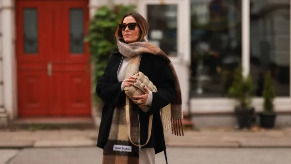 HAMBURG, GERMANY - AUGUST 30: Elise Soho wearing Joseph beige two piece, Acne Studios navy blue trenchcoat on August 30, 2021 in Hamburg, Germany. (Photo by Jeremy Moeller/Getty Images)