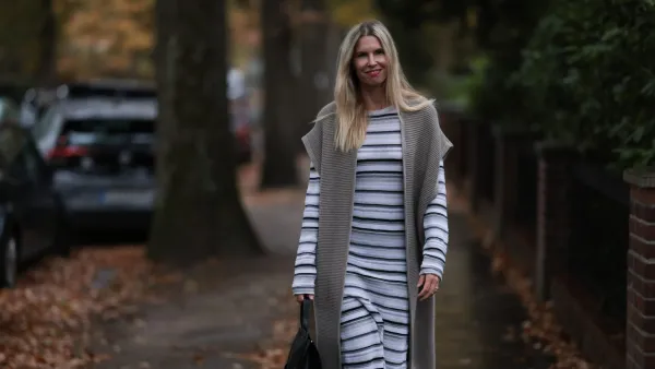 HAMBURG, GERMANY - NOVEMBER 17: Vanessa Giers seen wearing SoSUE Laura black and white knit dress ,SoSUE Knit Cosy Azteco beige vest, Naditum black leather handbag, & other stories black boots on November 17, 2022 in Hamburg, Germany. (Photo by Jeremy Moeller/Getty Images)