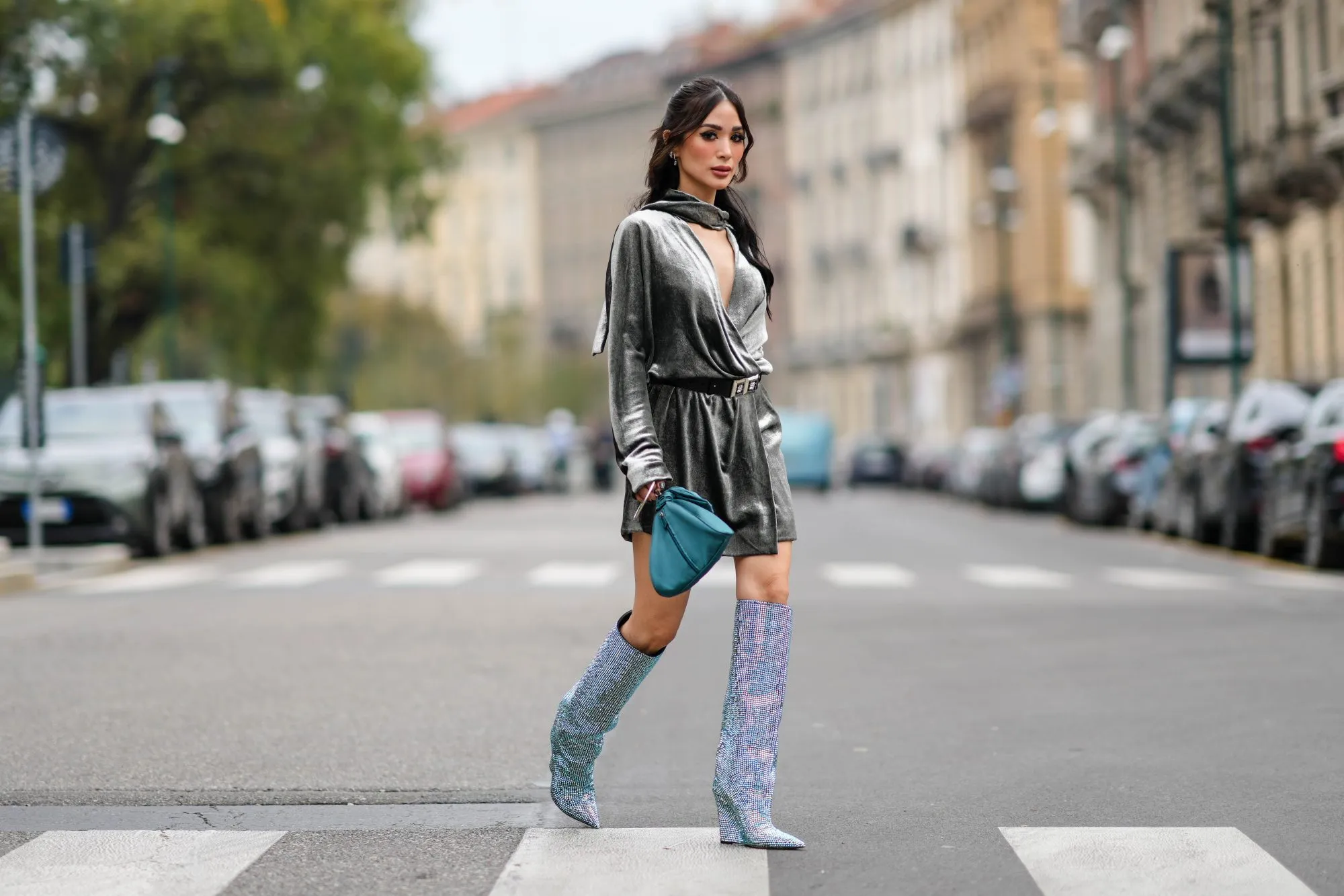MILAN, ITALY - SEPTEMBER 20: Heart Evangelista wears a gray satin shiny / silver / lustrous gathered puffy mini / short dress, a blue bag, knee-high sequin shiny pointed boots, outside Alberta Ferretti, during the Milan Fashion Week - Womenswear Spring/Summer 2024 on September 20, 2023 in Milan, Italy. (Photo by Edward Berthelot/Getty Images)