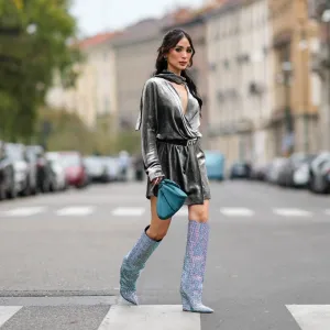 MILAN, ITALY - SEPTEMBER 20: Heart Evangelista wears a gray satin shiny / silver / lustrous gathered puffy mini / short dress, a blue bag, knee-high sequin shiny pointed boots, outside Alberta Ferretti, during the Milan Fashion Week - Womenswear Spring/Summer 2024 on September 20, 2023 in Milan, Italy. (Photo by Edward Berthelot/Getty Images)