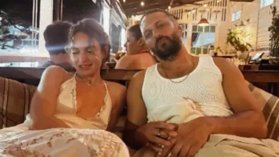 Lily James Stuns in a White Lace Naked Dress in Australia