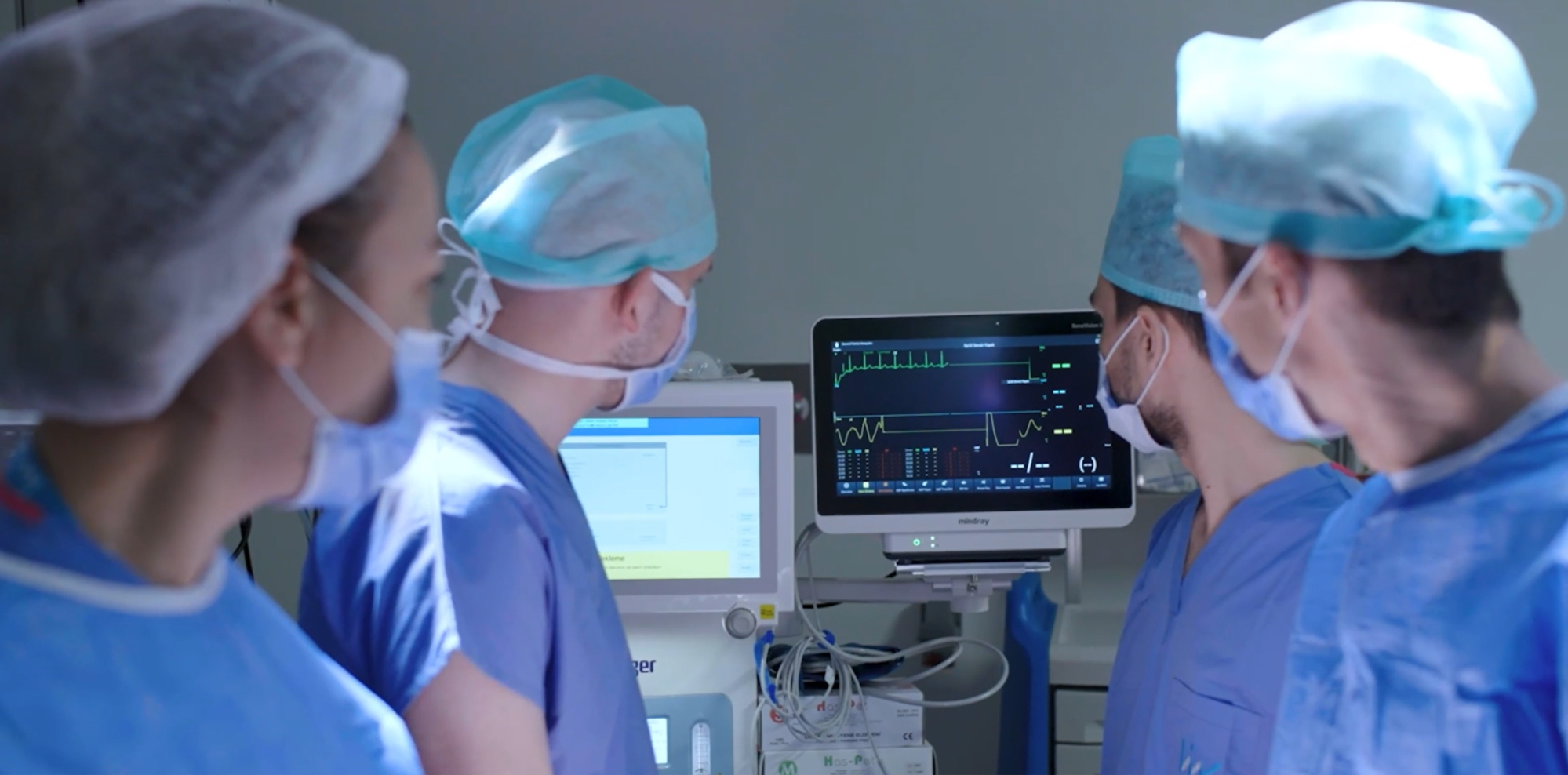Medical professionals examining an EKG at Liv Hospital