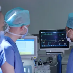 Medical professionals examining an EKG at Liv Hospital