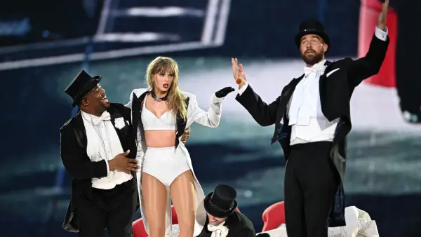 Taylor-Swift-and-Kam-Saunders-With-Travis-Kelce-GettyImages-2158904096.