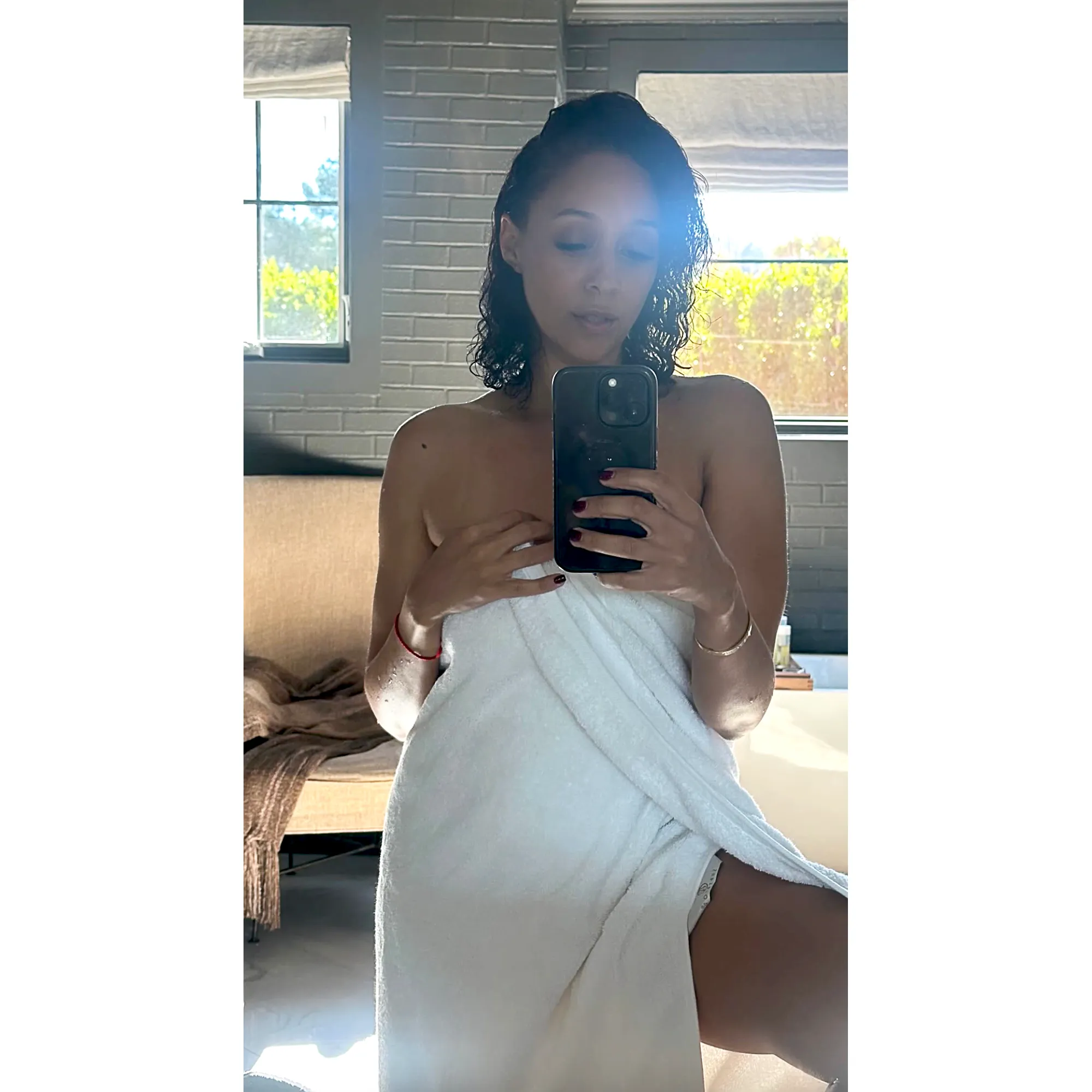 Tia Mowry Leaves Little to the Imagination While Posing in a Towel
