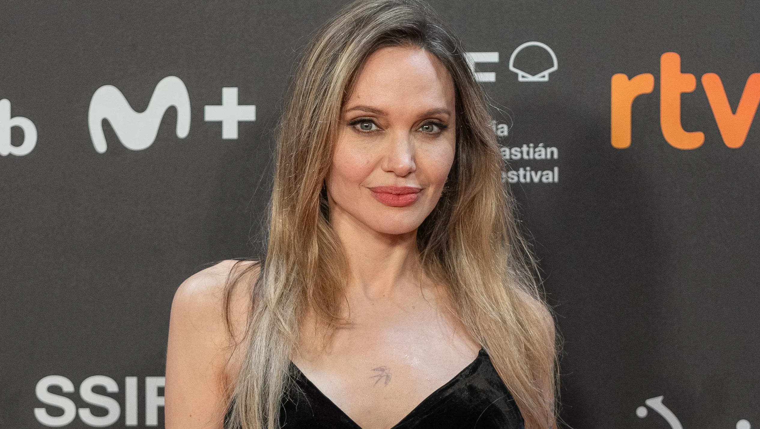 SAN SEBASTIAN, SPAIN - SEPTEMBER 21: Co-producer and actress Angelina Jolie,director Alice Winocour (not seen), actress Garance Marillier (not seen), actor Louis Garrel (not seen), actress Anyier Anei (not seen), and actress Ella Rumpf (not seen), pose on the red carpet before the screening of the film 'The Couture' in the official section of the 73rd San Sebastian International Film Festival at Kursaal Palace in San Sebastian, Spain, on September 21, 2025. (Photo by Javi Julio/Anadolu via Getty Images)
