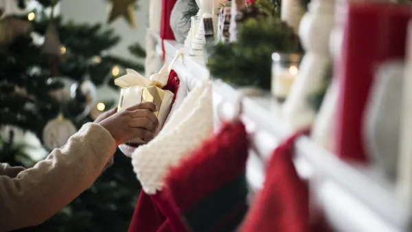 Christmas stockings are hanging by the chimney
