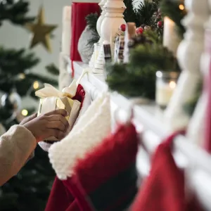 Christmas stockings are hanging by the chimney