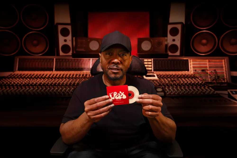 Timbaland posing with Babybel cheese