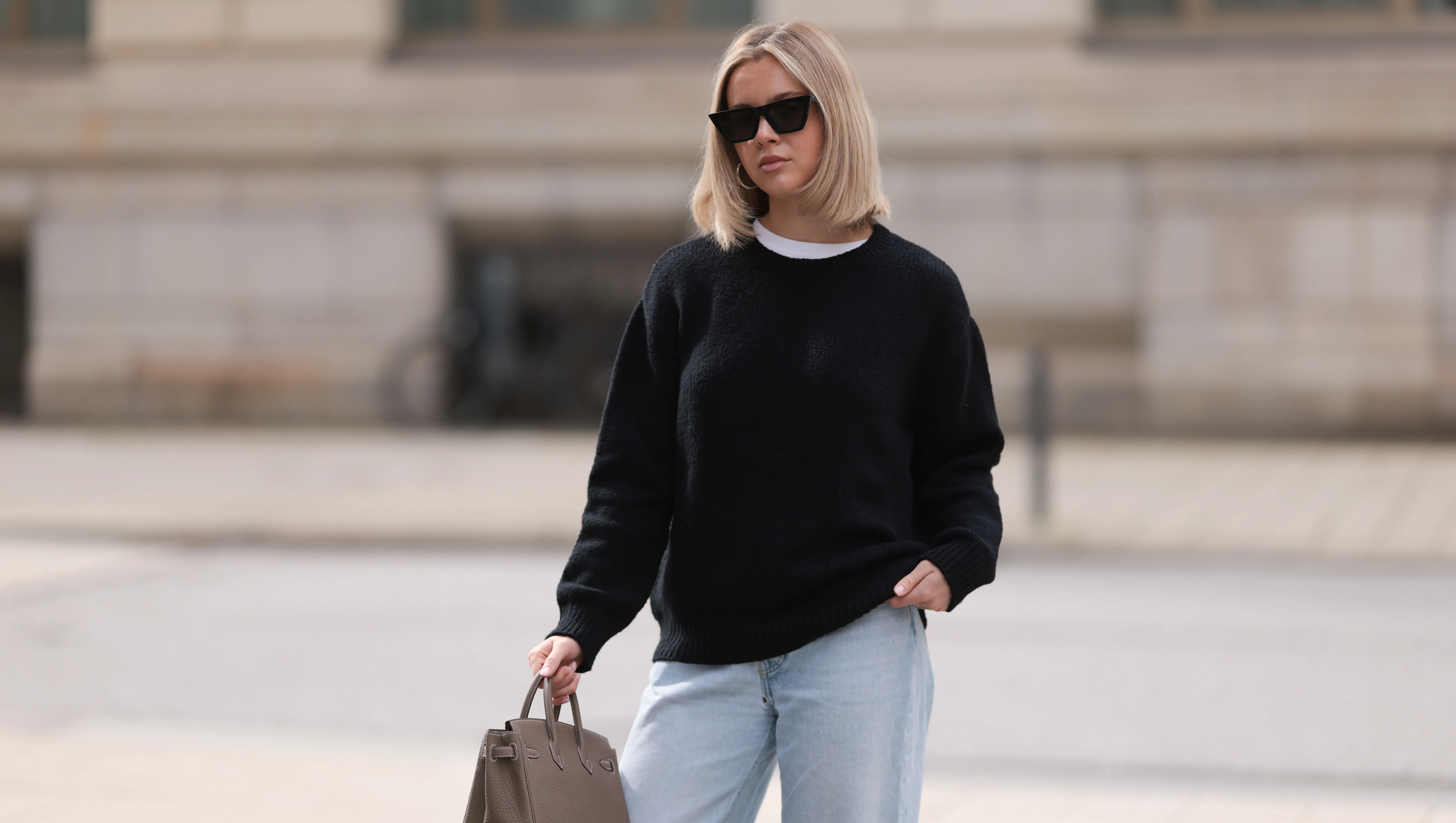 HAMBURG, GERMANY - APRIL 05: Isabelle Hartmann seen wearing Celine black sunglasses, Almada Label black cashmere wool knit sweater, Levi&rsquo;s light blue vintage denim and Herm&egrave;s Birkin 25 brown / taupe leather handbag on April 05, 2024 in Hamburg, Germany. (Photo by Jeremy Moeller/Getty Images)