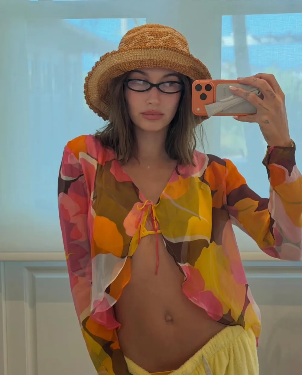 Hailey Bieber Is Effortlessly Hot in a Strappy Lace-Up Leopard-Print Swimsuit