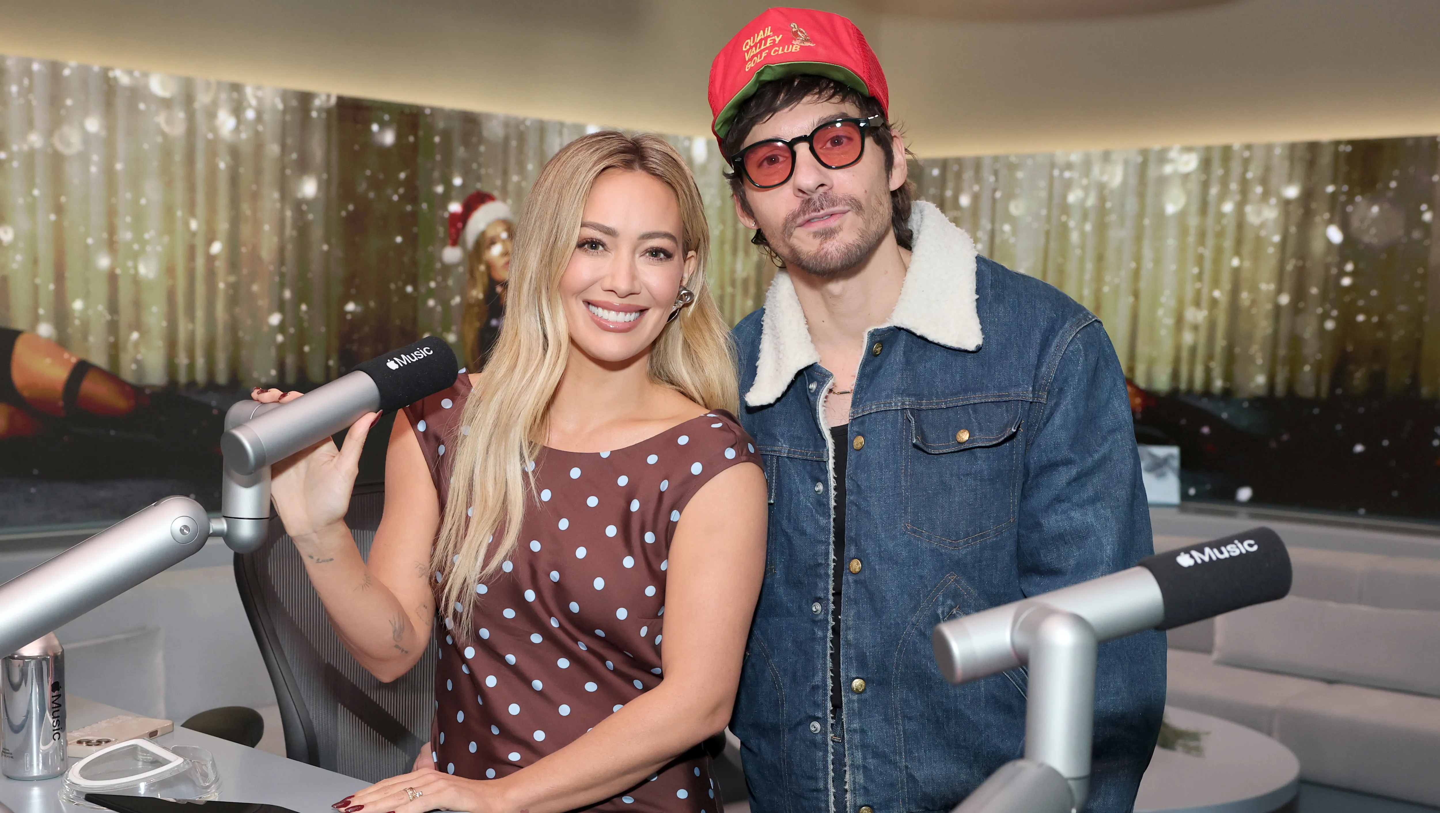 LOS ANGELES, CALIFORNIA - DECEMBER 04: (L-R) Hilary Duff and Matthew Koma live on air at Apple Music Studios during a holiday Apple Music radio takeover on December 04, 2025 in Los Angeles, California. (Photo by Amy Sussman/Getty Images for Apple Music)