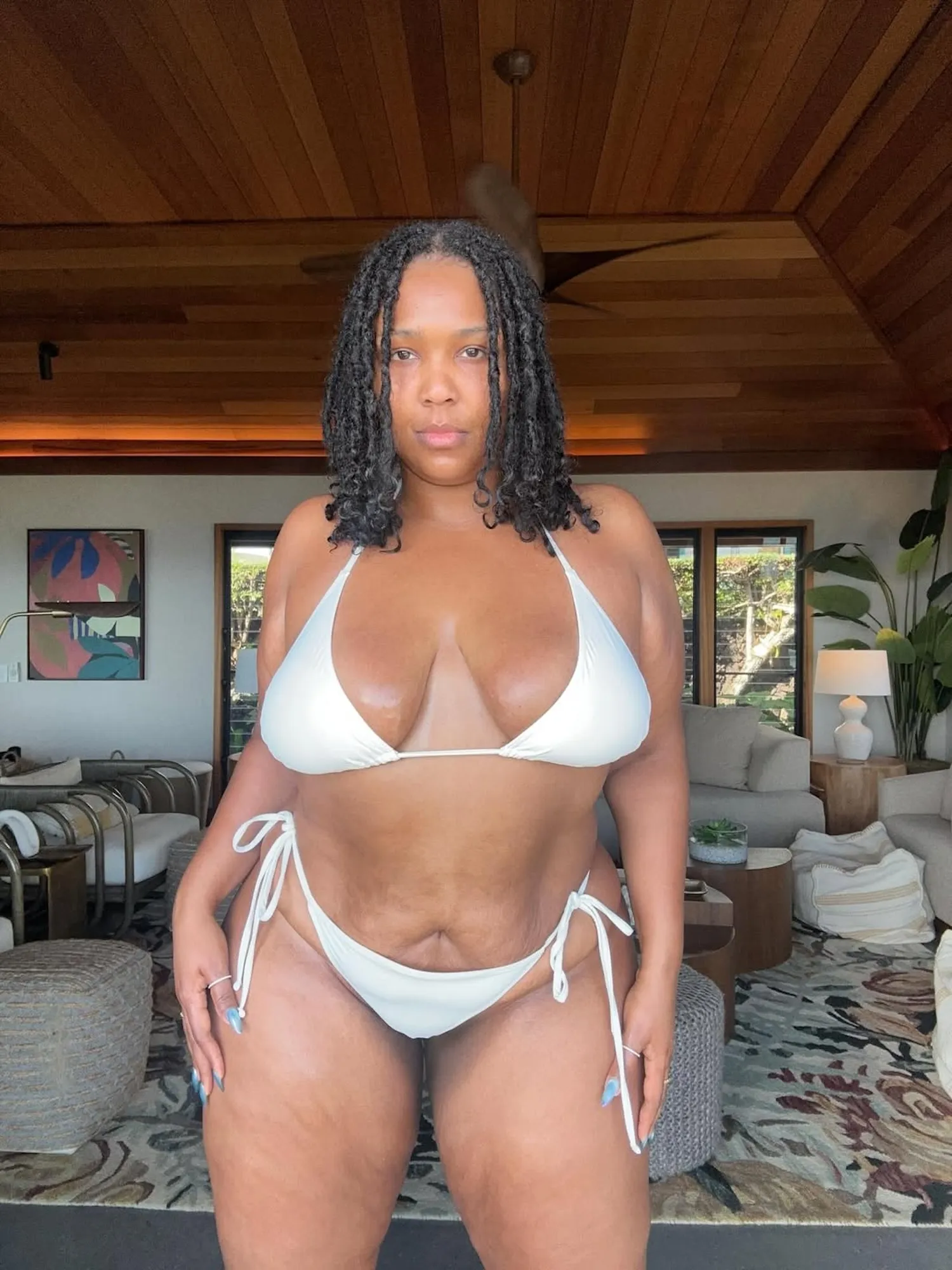 Lizzo Shares Tiny White Bikini Thirst Trap Amid Weight Loss in 1st Post of the New Year