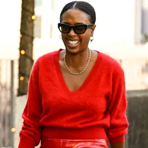 PARIS, FRANCE - SEPTEMBER 30: Nicole Martine Chapoteau is seen wearing a red sweater, red shiny skirt, blue bag and black heels with black sunglasses outside the Dries Van Noten show during the Womenswear Spring Summer 2026 as part of Paris Fashion Week on September 30, 2025 in Paris, France. (Photo by Daniel Zuchnik/Getty Images)