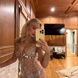 Sabrina Carpenter Shows Off a Silver Thong Underneath Her Glittering Naked Dress