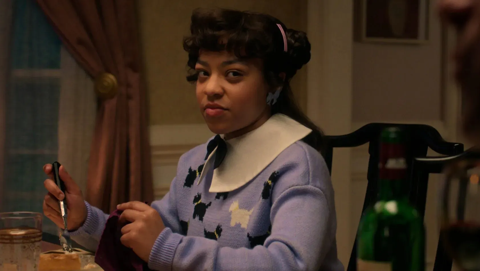 Erica Sinclair wearing a dog sweater on Stranger Things
