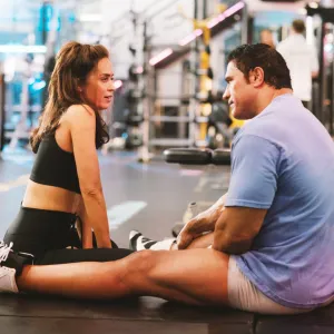 Emily Blunt as Dawn Staples, Dwayne Johnson as Mark Kerr in The Smashing Machine