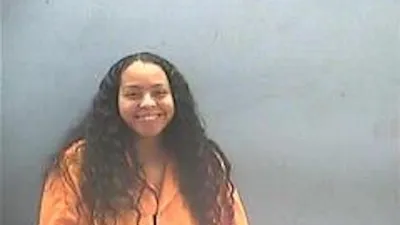 Woman Shows No Remorse, Smiles in Mugshot After Beating Pregnant Mother of 2 With Baseball Bat