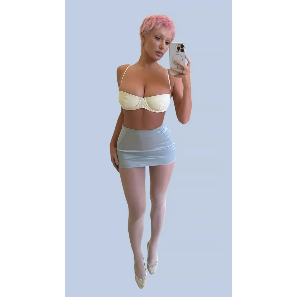 Bianca Censori Debuts Pink Pixie Hair in a Daring Crop Top and Micro Mini Skirt