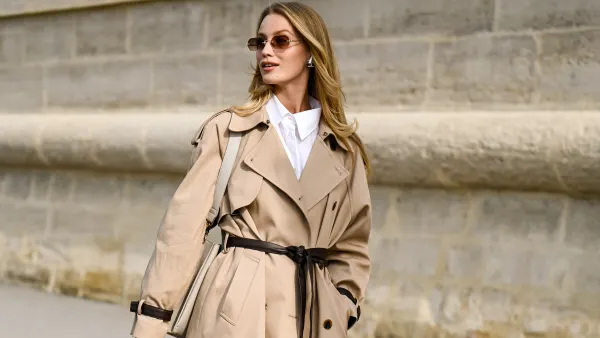 Jana Hakkinen is seen wearing a tan trench coat with belt, white shirt, gray bag and eyewear outside the Dior show during the Womenswear Spring Summer 2026 as part of Paris Fashion Week on October 01, 2025 in Paris, France.