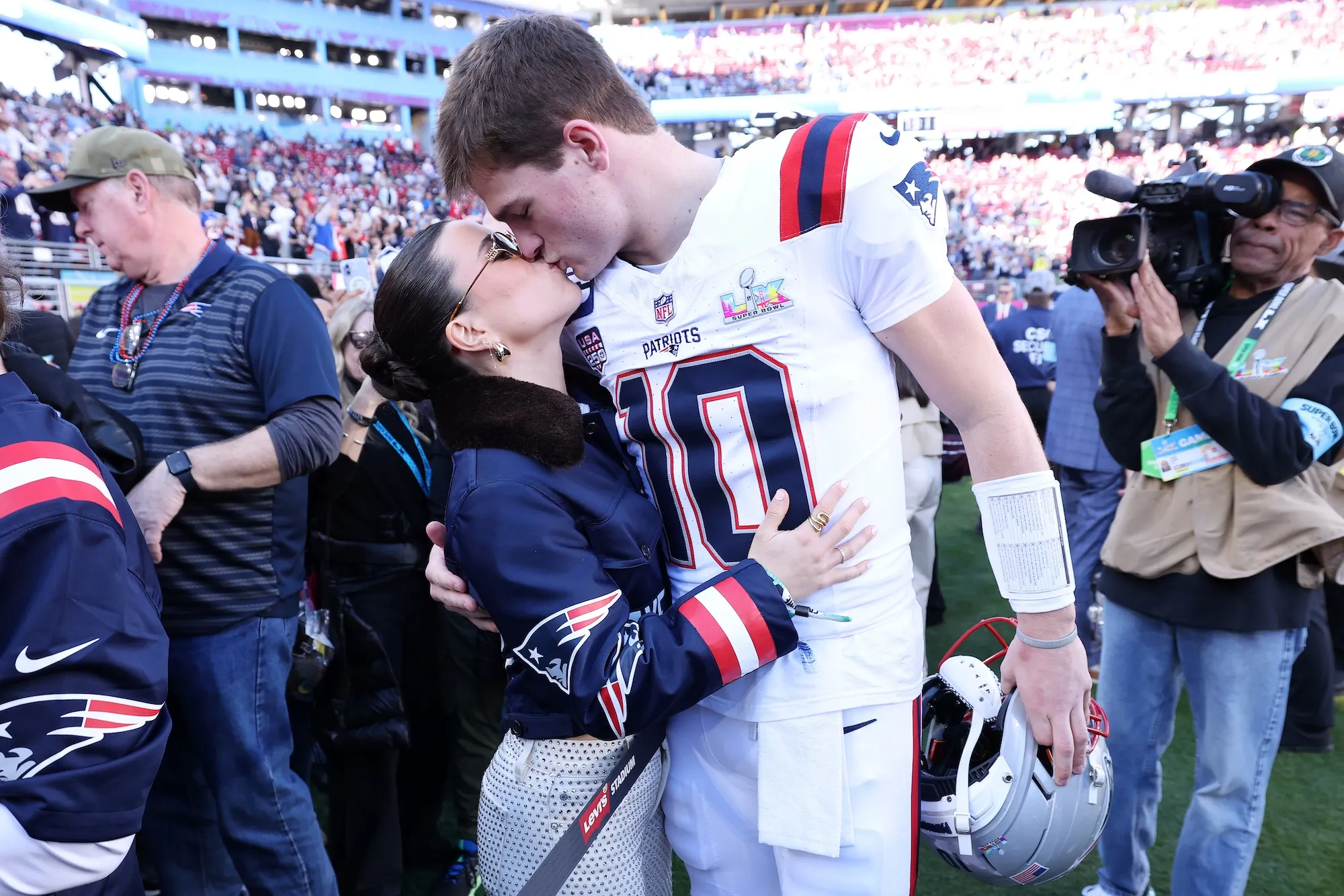 Patriots QB Drake Mayes Wife Ann Rocks Jersey Jacket Ahead of Super Bowl 2026