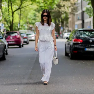 COLOGNE, GERMANY - JUNE 2: Golestaneh Mayer-Uellner wearing a white Zara lace top, wide leg pants from Fall Winter Spring Summer (FWSS), Slingbacks from Chanel as shoes, white Celine bag and sunglasses on June 2, 2016 in Cologne, Germany. (Photo by Christian Vierig/Getty Images)