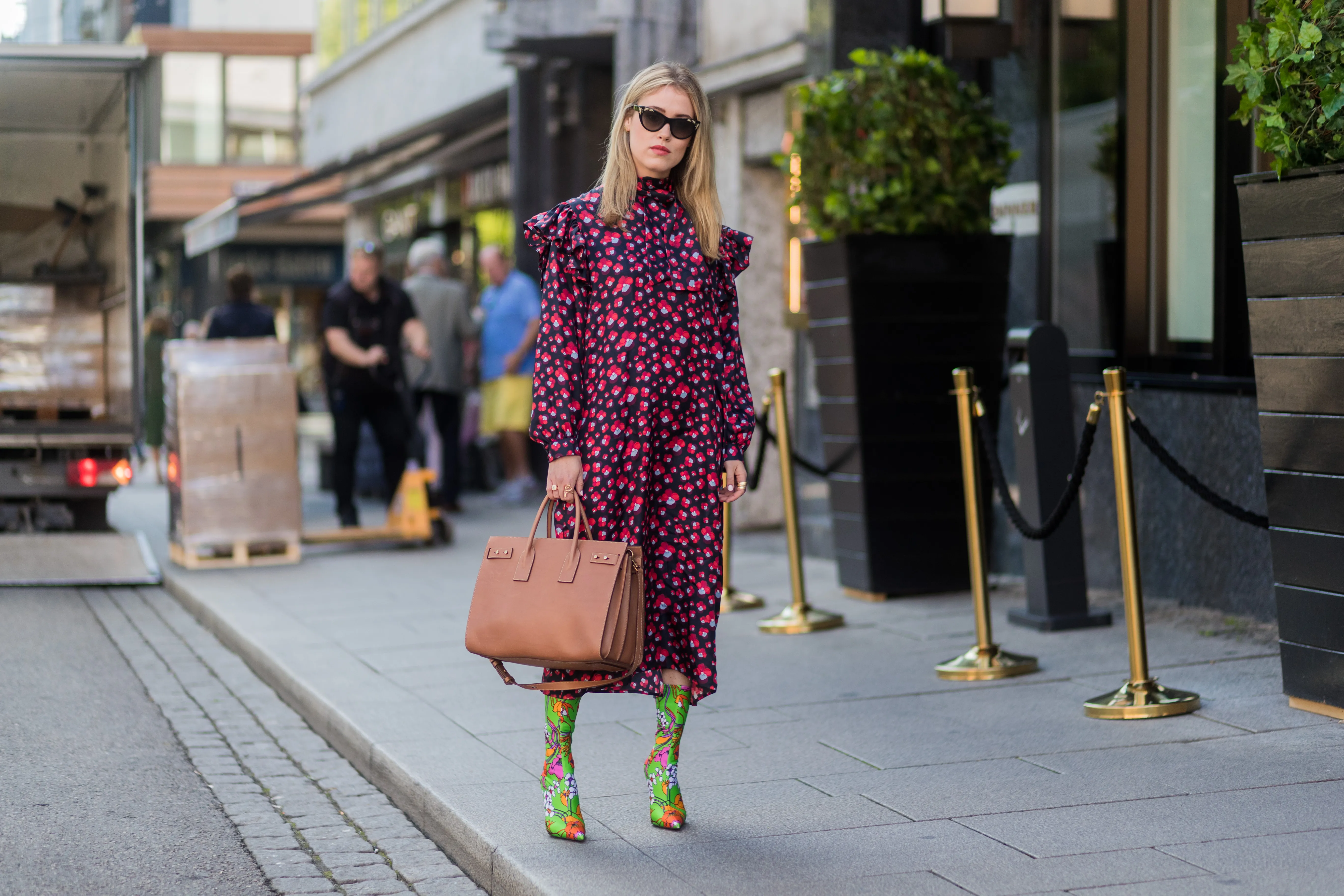 OSLO, NORWAY - AUGUST 22: Annabel Rosendahl wearing a red dress, sock boots with floral print outside byTiMo on August 22, 2017 in Oslo, Norway. (Photo by Christian Vierig/Getty Images)