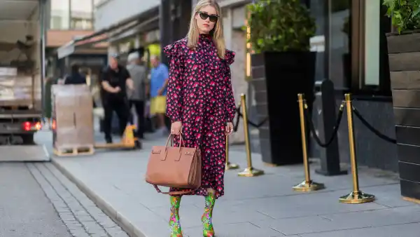 OSLO, NORWAY - AUGUST 22: Annabel Rosendahl wearing a red dress, sock boots with floral print outside byTiMo on August 22, 2017 in Oslo, Norway. (Photo by Christian Vierig/Getty Images)