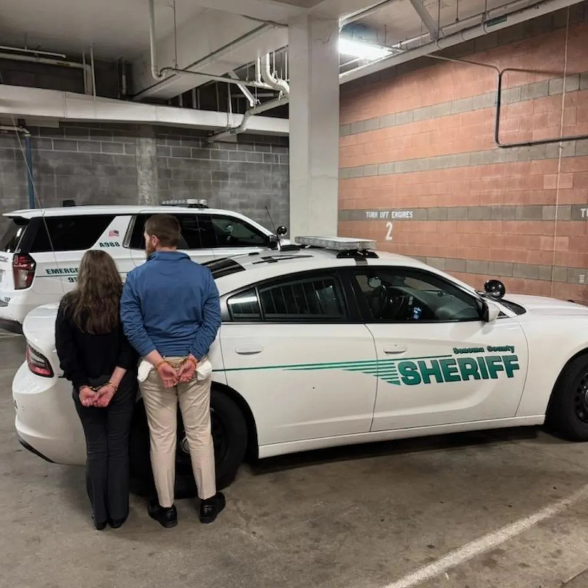 A photo shows two of the suspects soon after they were arrested