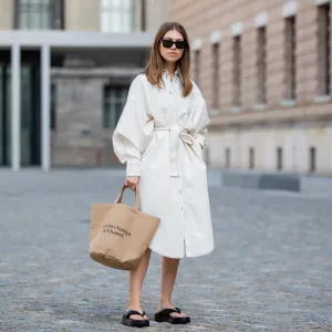BERLIN, GERMANY - JULY 07: Swantje Soemmer is seen wearing white dress Blanche, Rayban sunglasses, Arket plateau flip flops, Chanel beach bag on July 07, 2020 in Berlin, Germany. (Photo by Christian Vierig/Getty Images)