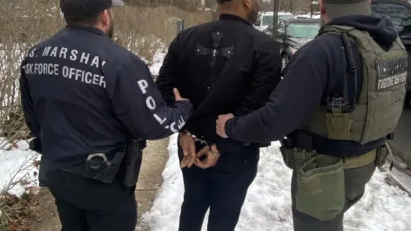 A photo shows the arrest of Michael Robinson