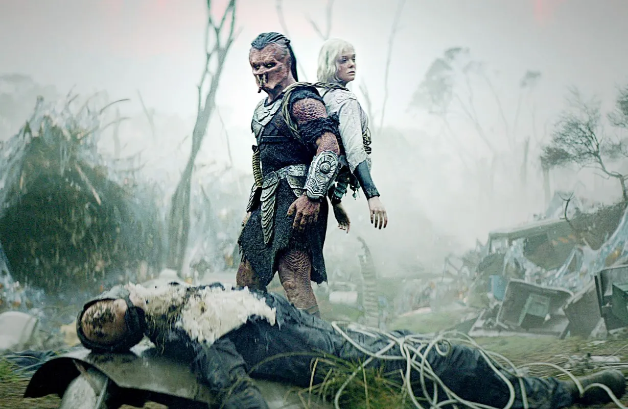 Dimitrius Schuster-Koloamatangi and Elle Fanning in Predator: Badlands