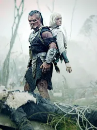 Dimitrius Schuster-Koloamatangi and Elle Fanning in Predator: Badlands