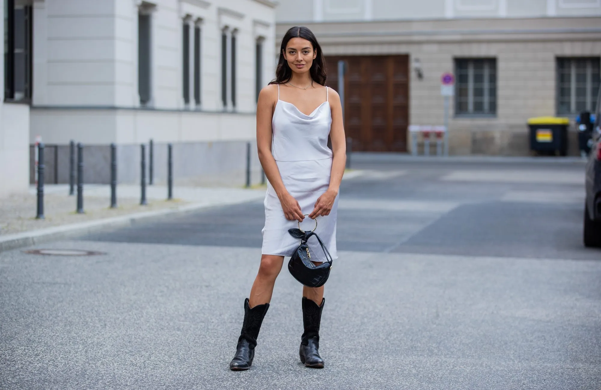 BERLIN, GERMANY - JUNE 14: Alyssa Cordes is seen wearing blue dress Samsoe Samsoe, bag Borbonese, vintage cowboy boots on June 14, 2021 in Berlin, Germany. (Photo by Christian Vierig/Getty Images)