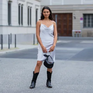 BERLIN, GERMANY - JUNE 14: Alyssa Cordes is seen wearing blue dress Samsoe Samsoe, bag Borbonese, vintage cowboy boots on June 14, 2021 in Berlin, Germany. (Photo by Christian Vierig/Getty Images)