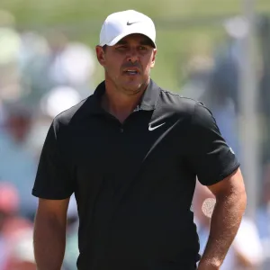 GettyImages-2267717697 Brooks Koepka consoles young girl trapped under golf cart