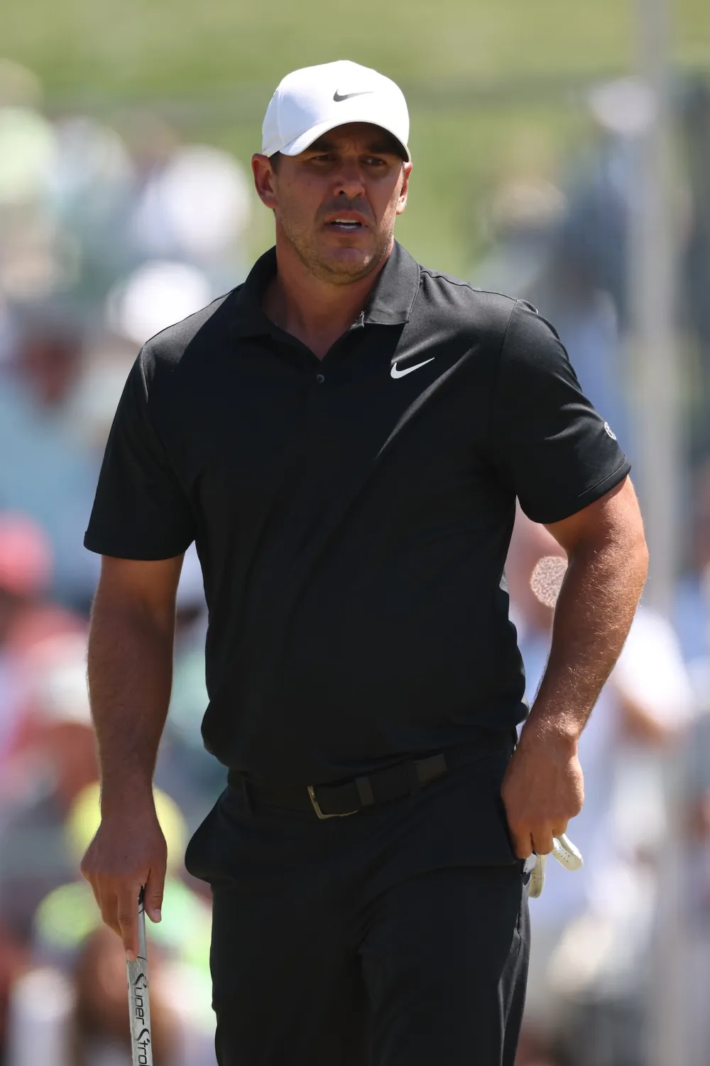 GettyImages-2267717697 Brooks Koepka consoles young girl trapped under golf cart