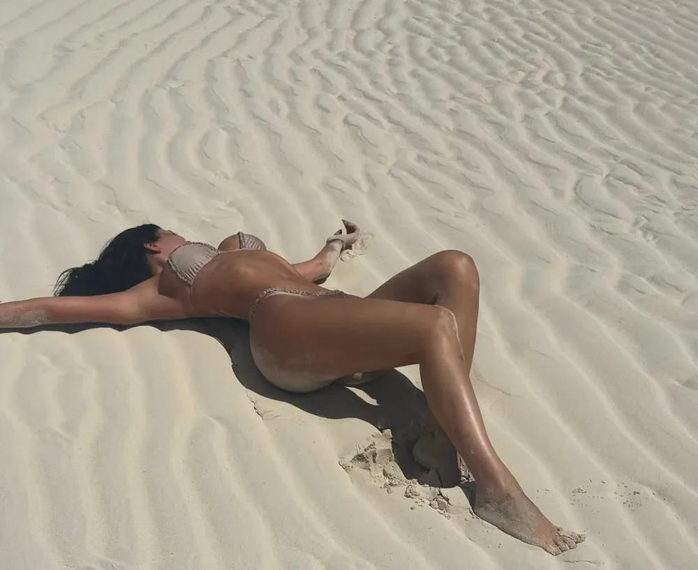 Kylie Jenner Poses in the Sand While Rocking a Tan-Colored Bikini on Vacation: 'DND'