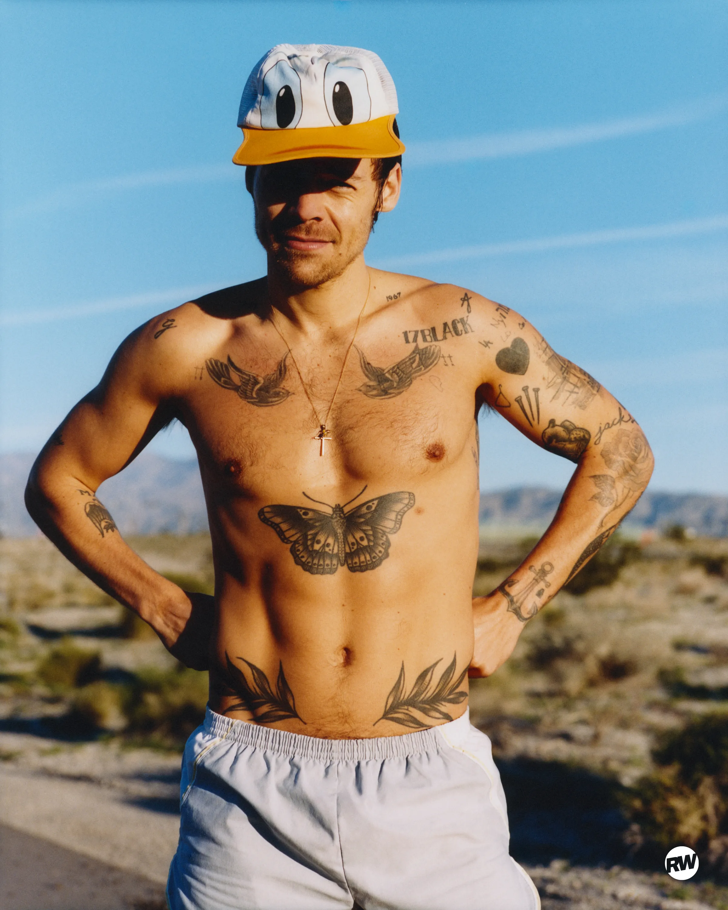 Harry Styles shirtless in 'Runner's World' magazine