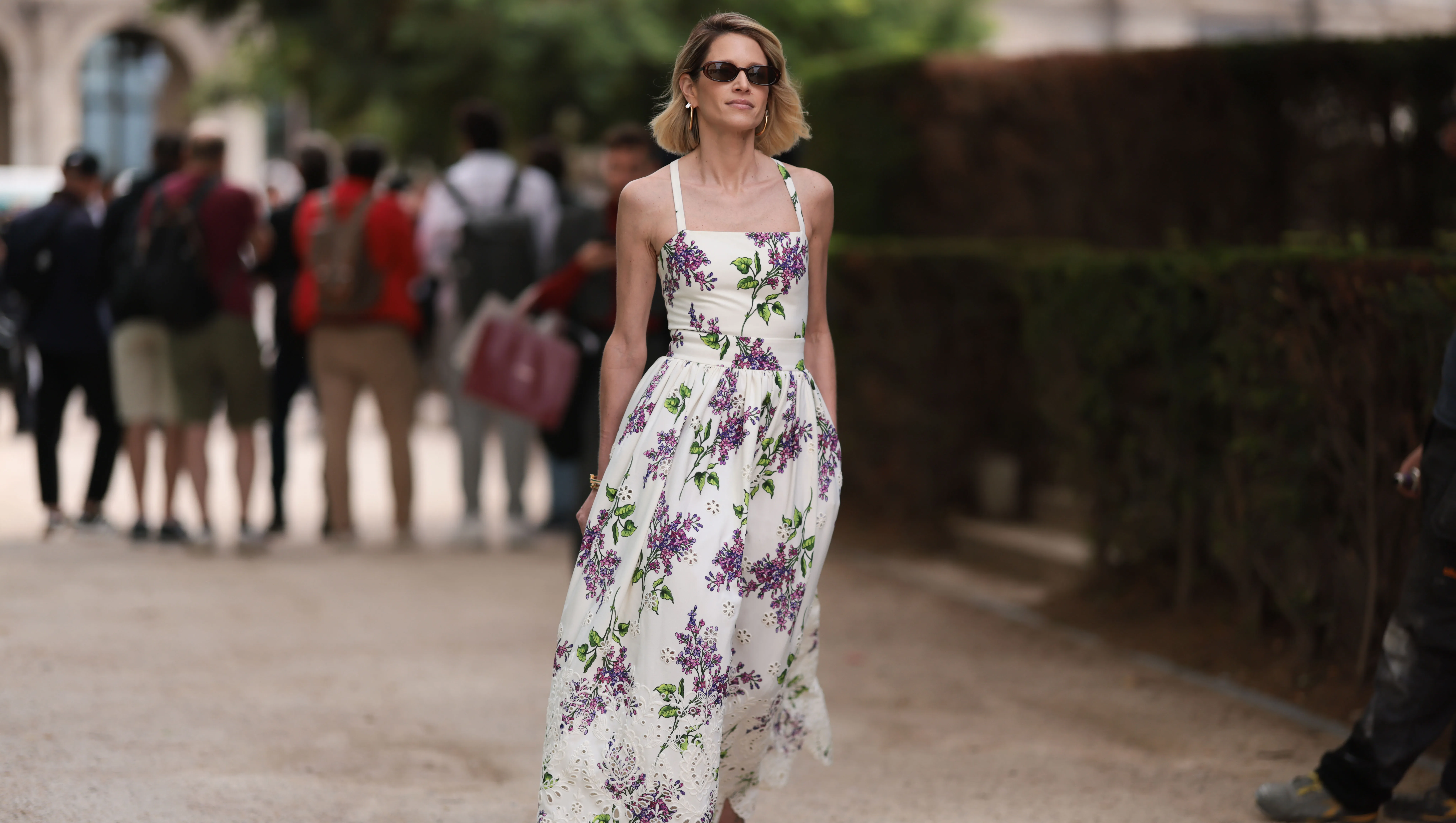PARIS, FRANCE - JULY 05: Helena Bordon seen outside Elie Saab show wearing black small sunnies, shoulder strap white lace dress with lilac flower details and lilac heels during the Haute Couture Fall/Winter 2023/2024 as part of Paris Fashion Week on July 05, 2023 in Paris, France. (Photo by Jeremy Moeller/Getty Images)