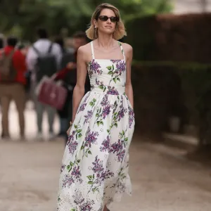 PARIS, FRANCE - JULY 05: Helena Bordon seen outside Elie Saab show wearing black small sunnies, shoulder strap white lace dress with lilac flower details and lilac heels during the Haute Couture Fall/Winter 2023/2024 as part of Paris Fashion Week on July 05, 2023 in Paris, France. (Photo by Jeremy Moeller/Getty Images)