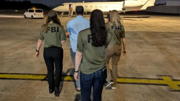 FBI agents take Zobaidul Amin into custody