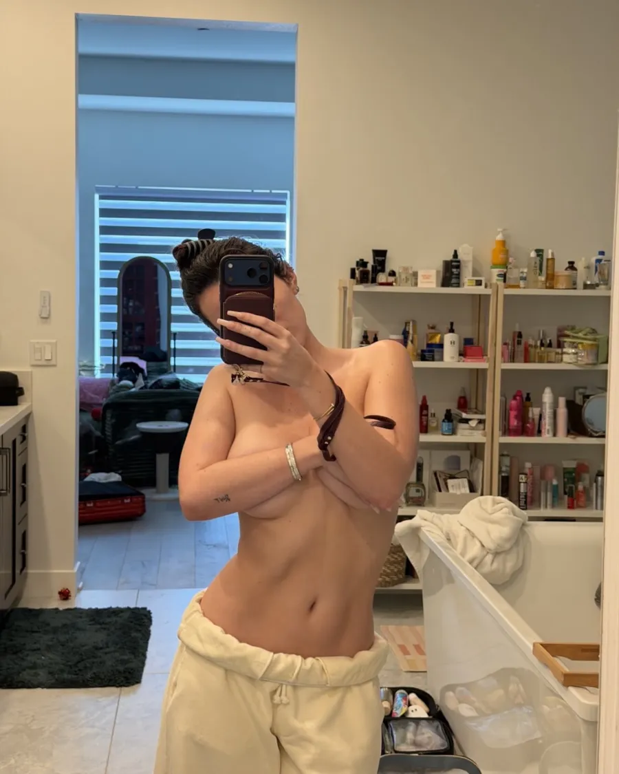 Bella Thorne Goes Topless and Shows Off Her Abs in Low-Rise Sweats as She Poses for Mirror Selfie