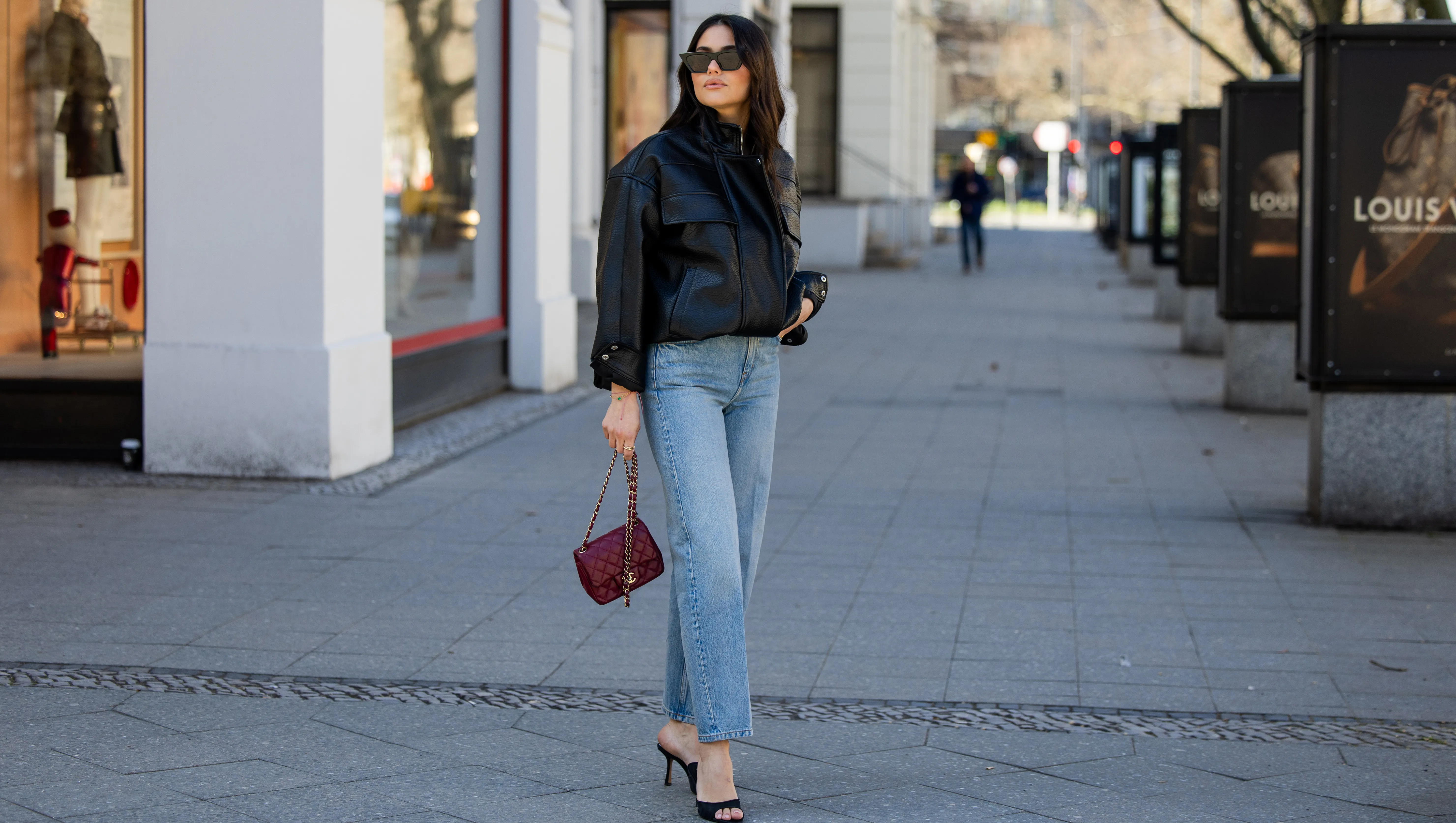 BERLIN, GERMANY - MARCH 23: Aylin Seng&uuml;l wears denim jeans &other stories, sunglasses Phoebe Philo, heels Mango, red bag Chanel on March 23, 2026 in Berlin, Germany. (Photo by Christian Vierig/Getty Images)