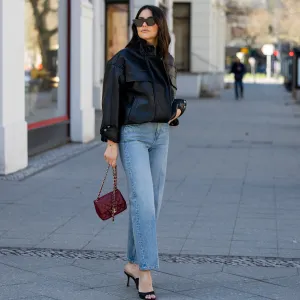 BERLIN, GERMANY - MARCH 23: Aylin Sengül wears denim jeans &other stories, sunglasses Phoebe Philo, heels Mango, red bag Chanel on March 23, 2026 in Berlin, Germany. (Photo by Christian Vierig/Getty Images)