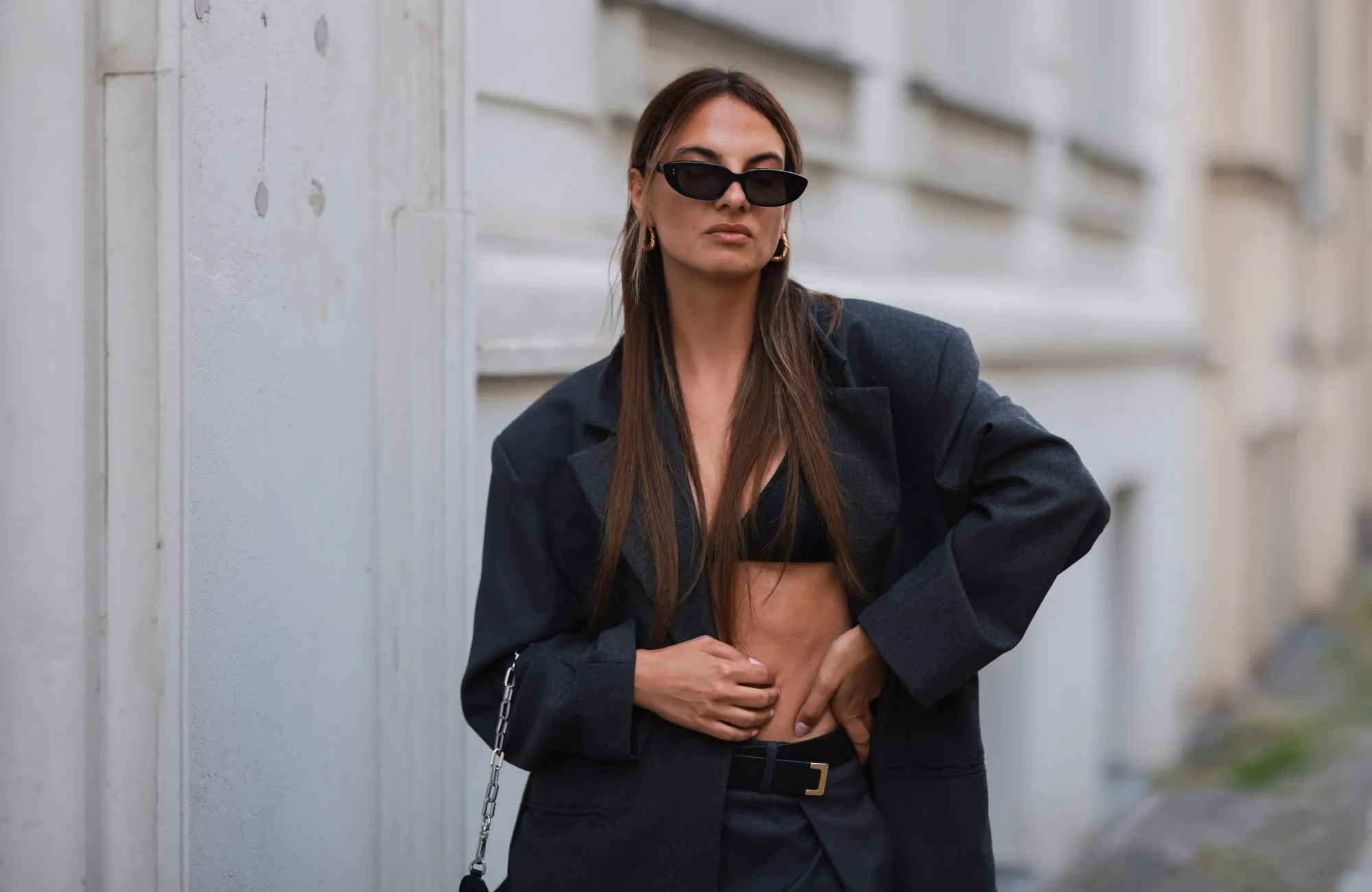 BERLIN, GERMANY - MAY 31: Anna Winter wearing grey Source unknown pants and grey Source Unknown Blazer, black Gucci bikini top, black prada bag and black shades on May 31, 2022 in Berlin, Germany. (Photo by Jeremy Moeller/Getty Images)